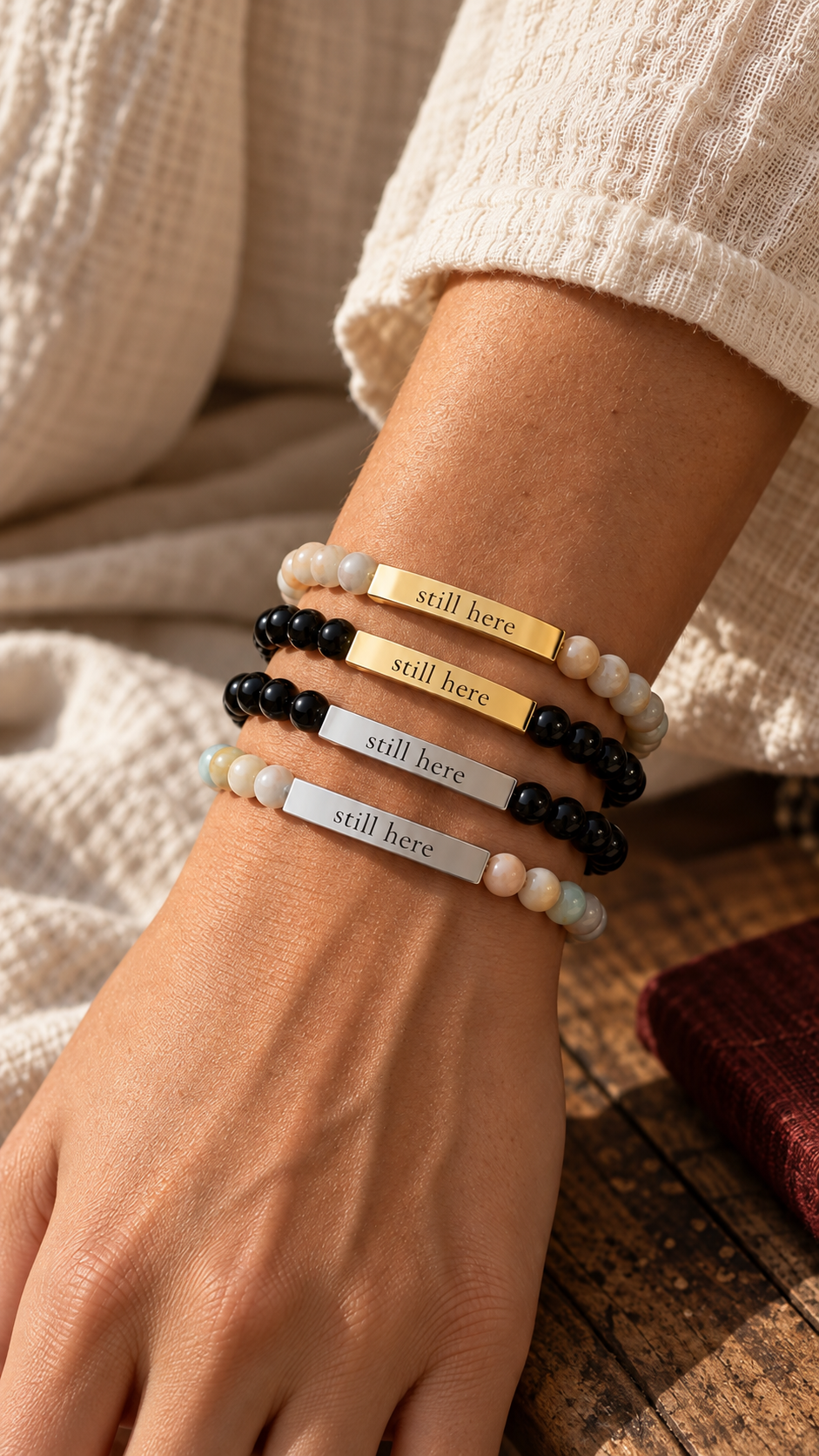 Still Here engraved stone bead bracelets in four finishes